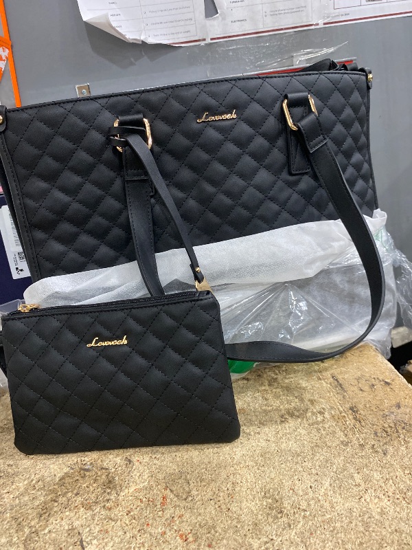 View 1 of 
Black women’s bag and purse