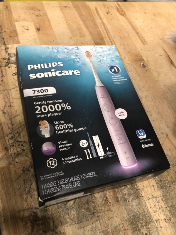 Photo 1 of **FACTORY SEALED** Philips Sonicare 7300 Series Electric Toothbrush - Next-Generation Sonicare Technology, Pressure Sensor, 12 Brushing Settings, SmarTimer, 21-Day Runtime, Travel Case, Light Pink, HX7422/04