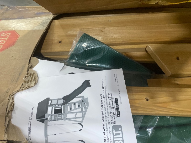 Photo 1 of Backyard Discovery Buckley Hill Cedar Wood Swing Set with Wave Slide, Play Deck, Rock Wall Ladder, Belt Swings, Chalkboard, Canopy Roof, Outdoor Playset