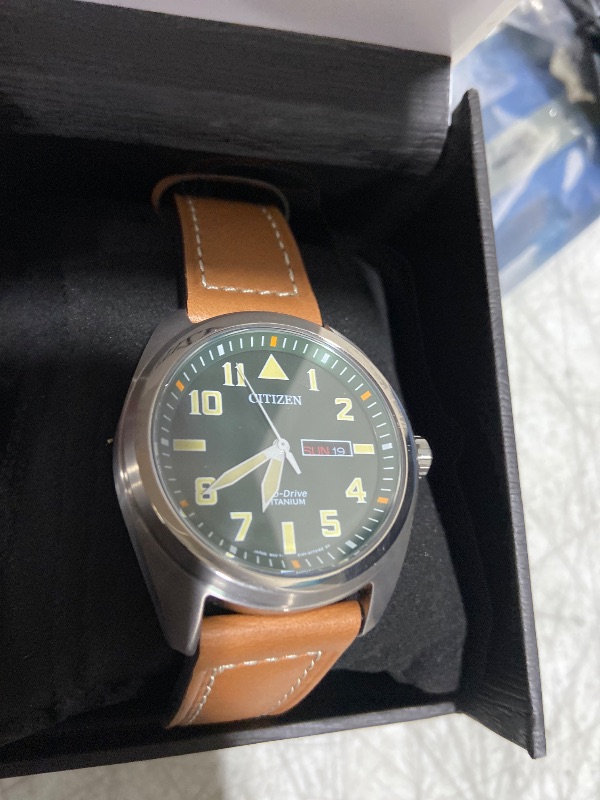Photo 1 of Citizen Men's Eco-Drive Weekender Garrison Field Watch in Super Titanium with Brown Leather Strap, Green Dial (Model: BM8560-02X)