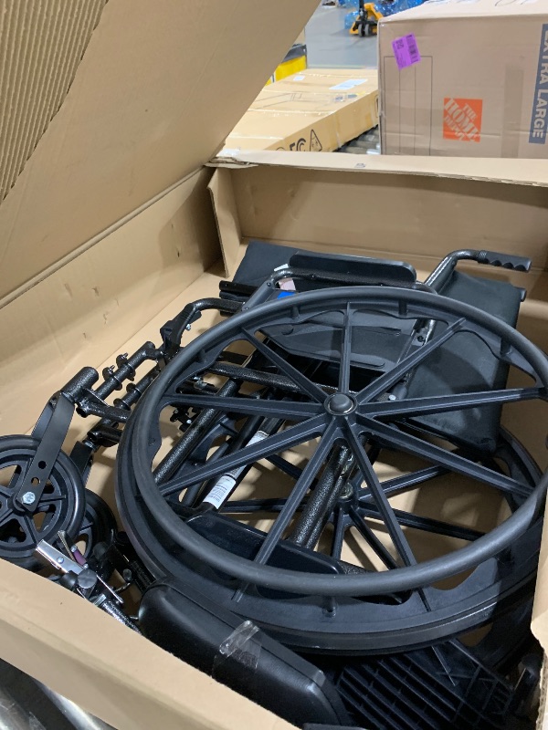 Photo 1 of Medline Comfortable Folding Wheelchair with Swing-Back, Desk-Length Arms and Elevating Footrests, 18”W x 16”D Seat,