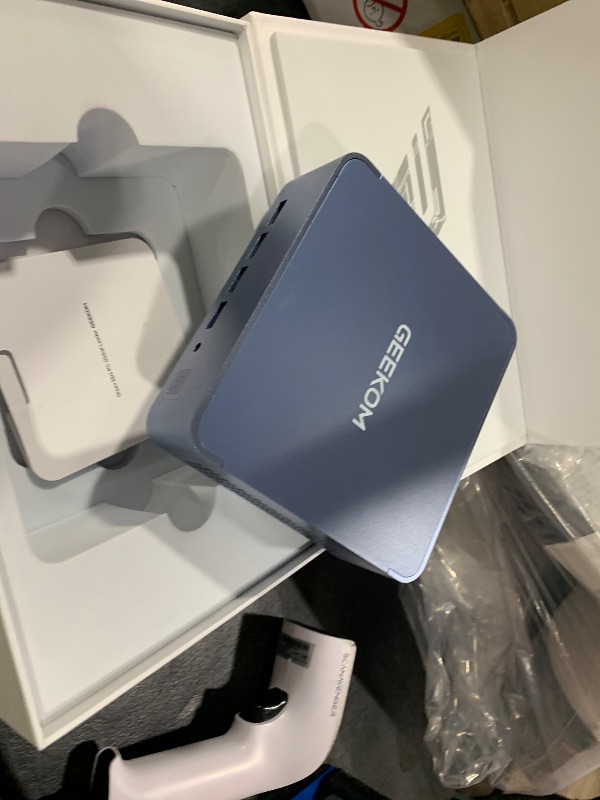 Photo 1 of GEEKOM AX8 Max Mini PC with AMD Ryzen 7 8745HS Dual 2.5GbE Lan Port| 32GB DDR5(Upgradable),1TB NVMe SSD(Expandable)| Radeon 780M,USB4.0(40Gbps),Quad Display| Windows 11 Pro Gaming,Office,Video Editing