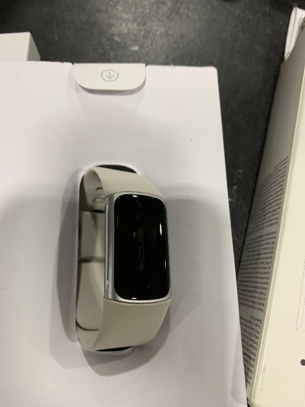 Photo 1 of Fitbit Charge 6 Fitness Tracker with Google apps, Heart Rate on Exercise Equipment, 6-Months Premium Membership Included, GPS, Health Tools and More, Porcelain/Silver, One Size (S & L Bands Included)