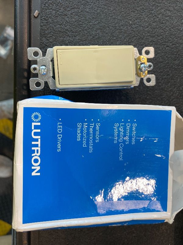 Photo 1 of Leviton 15 Amp, 120/277 Volt, Decora Rocker Single-Pole AC Quiet Switch, Residential Grade, Grounding, 5601-2T, Light Almond