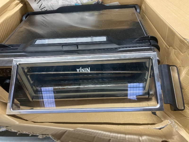 Photo 1 of ***significant damage to the top and the side***Ninja Digital Air Fryer & Toaster Oven | 8-in-1 Functionality | Flip-Up Design | XL Capacity | Air Fry Basket, Sheet Pan, Wire Rack & Crumb Tray | 1800 Watt | Silver | SP101***significant damage to the top a