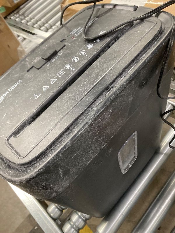 Photo 1 of ***DAMAGE -SELLING AS IS *** Amazon Basics 8-Sheet High SecuB0C6LZ8S34rity Cross Cut Paper and Credit Card Shredder with P-4 Security, Auto Shut-off, Black  ***USED, PAPER/DUST RESIDUE, NOISE -SELLING AS IS ONLY***