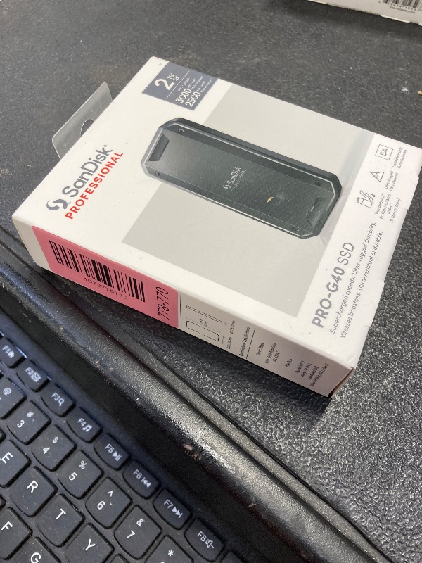Photo 1 of *** FACTORY SEALED, NO RETURNS , NO REFUNDS IF OPENED *** 
SanDisk Professional 2TB PRO-G40 SSD - Up to 2700MB/s, Thunderbolt 3 (40Gbps), USB-C (10Gbps), IP68 dust/Water Resistance, External Solid State Drive - SDPS31H-002T-GBCND