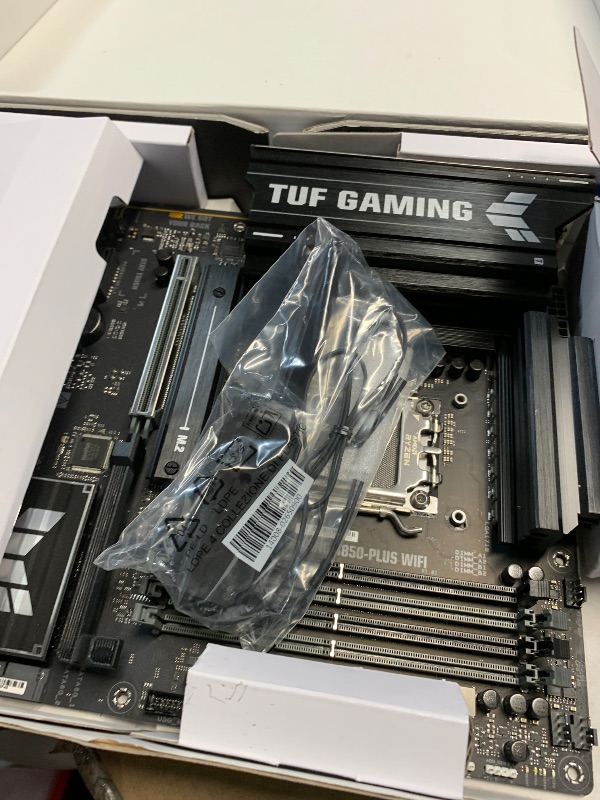 Photo 1 of **PINS BENT**ASUS TUF Gaming B850-PLUS WiFi AMD AM5 B850 ATX Motherboard, 14+2+1 80A Stages, AI Ready, DDR5, PCIe 5.0, 3X M.2, Wi-Fi 7, 2.5Gb LAN, DisplayPort, HDMI™, USB 10Gbps & 20Gbps Type-C®, BIOS Flashback™