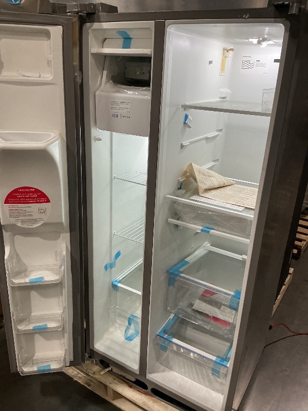 Photo 1 of ***MINOR DAMAGE****
***DAMAGED DURING TRANSIT - TRUCK/TRAILER PICKUP ONLY***Frigidaire 22.3-cu ft Standard-Depth 33-in Wide Side-by-Side Refrigerator with Ice Maker ,Water and Ice Dispenser ( Stainless Steel ) ENERGY STAR Certified
