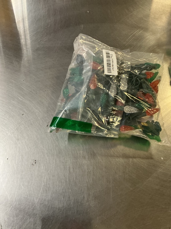 Photo 1 of ???Novelty Lights 24FT 70 LED C6 LED St. Patrick's Day String Lights, Outdoor Christmas Tree Commercial Grade LED String Lights, Christmas Lights Outdoor Tree Decorations Outdoor (Green/White/Orange)