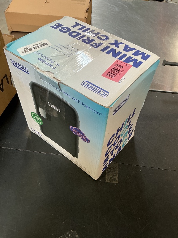 Photo 1 of **USED** Chefman - Iceman Mini Portable Black Personal Fridge Cools Or Heats and Provides Compact Storage For Skincare, Snacks, Or 6 12oz Cans W/A Lightweight 4-liter Capacity To Take On The Go
