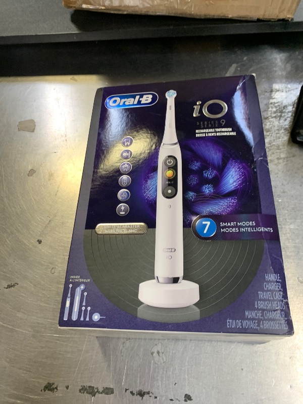 Photo 1 of Oral-B Rechargeable Electric Toothbrush, iO9 Genius, 7 Cleaning Modes, Interactive Display, Charging Travel Case, Visible Pressure Sensor, 4 Brush Heads, White Alabaster
