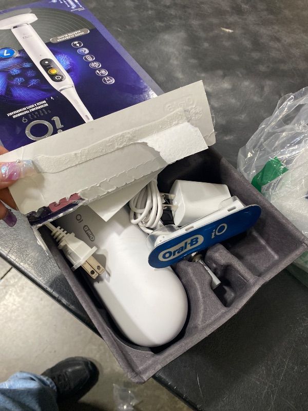 Photo 1 of Oral-B Rechargeable Electric Toothbrush, iO9 Genius, 7 Cleaning Modes, Interactive Display, Charging Travel Case, Visible Pressure Sensor, 4 Brush Heads, White Alabaster