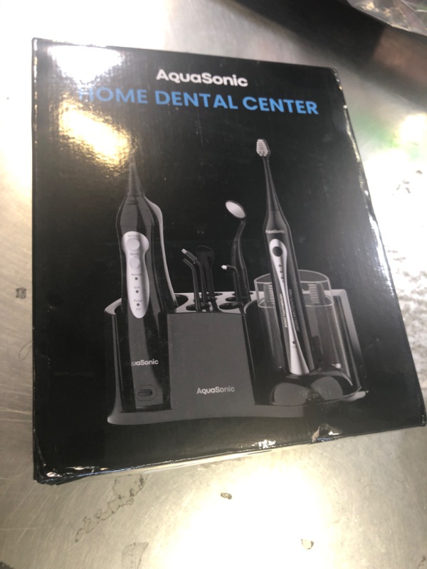 Photo 1 of AquaSonic Home Dental Center Rechargeable Power Toothbrush & Smart Water Flosser - Complete Family Oral Care System - 10 Attachments and Tips Included - Various Modes & Timers (Black)