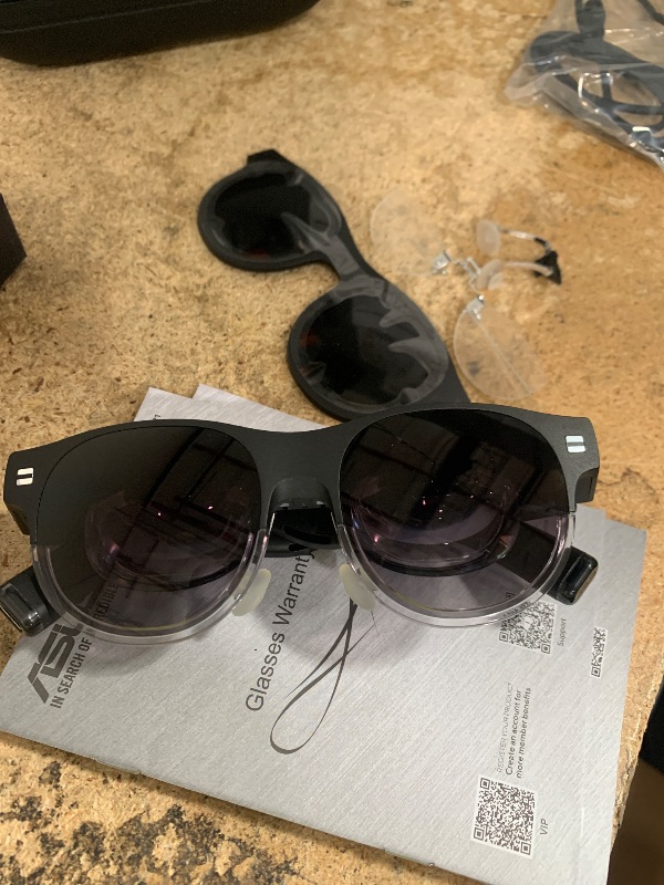 Photo 1 of ***RIGHT SIDE IS BLURRY***
ASUS AirVision M1 Smart AR Glasses - 100" Micro-OLED Wearable Display, 1100 nits, Multi-Screen, Speakers, USB-C, Magnetic Shade, Designed for ROG Ally/Steam Deck/PC/iPhone 16/15/Android/Mac/Tablet