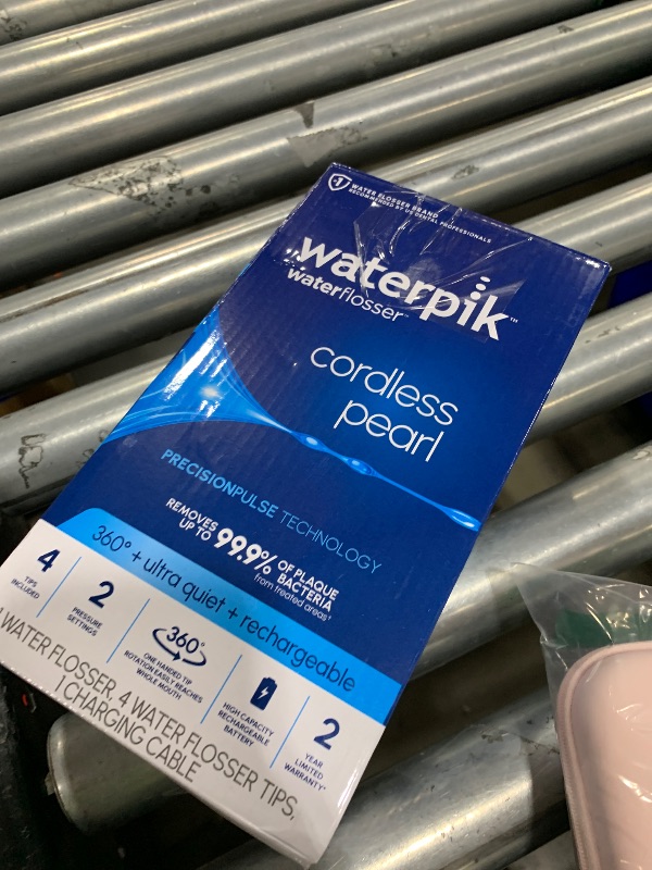 Photo 1 of Waterpik Cordless Pearl Rechargeable Portable Water Flosser for Teeth, Gums, Braces Care and Travel, Extra Quiet, 4 Flossing Tips - ADA Accepted, WF-13 Black, Amazon Exclusive