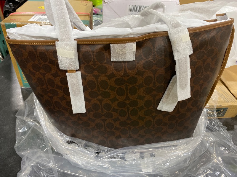 Photo 1 of Coach Women's Taxi Tote Bag In Signature Canvas Maple Sable One Size