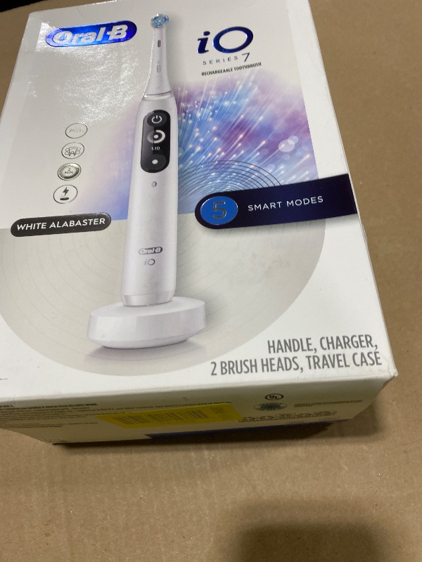 Photo 1 of Oral-B Rechargeable Electric Toothbrush, iO7 Adaptable Clean, 5 Cleaning Modes, Visual Pressure Sensor to Protect Gums, Charging Travel Case, 2 Brush Heads, White
