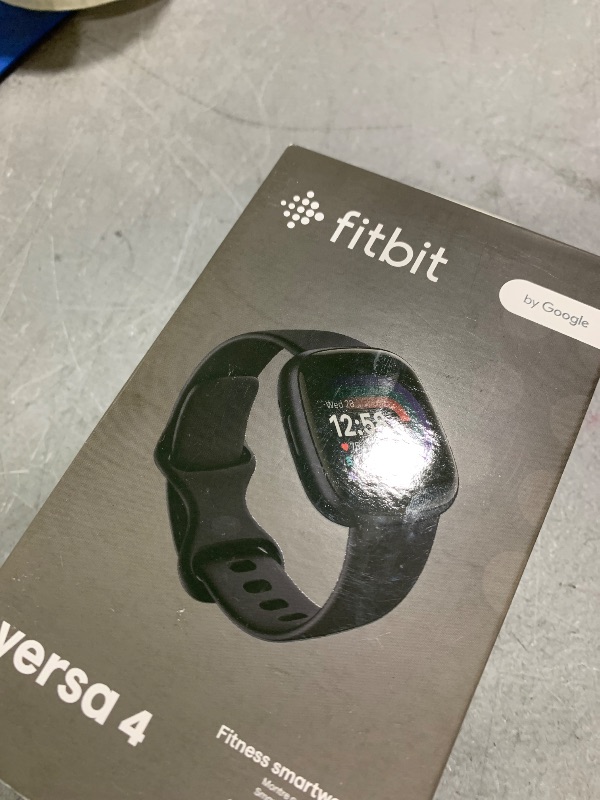Photo 1 of Fitbit Versa 4 Fitness Smartwatch with Daily Readiness, GPS, 24/7 Heart Rate, 40+ Exercise Modes, Sleep Tracking and more, Black/Graphite, One Size (S & L Bands Included)