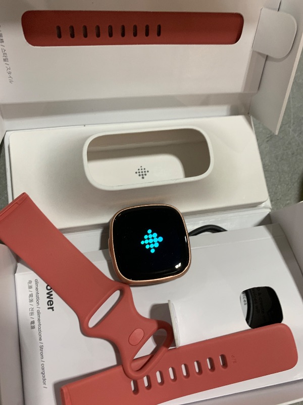 Photo 1 of Fitbit Versa 4 Fitness Smartwatch with Daily Readiness, GPS, 24/7 Heart Rate, 40+ Exercise Modes, Sleep Tracking and more, Pink Sand/Copper Rose, One Size (S & L Bands Included)