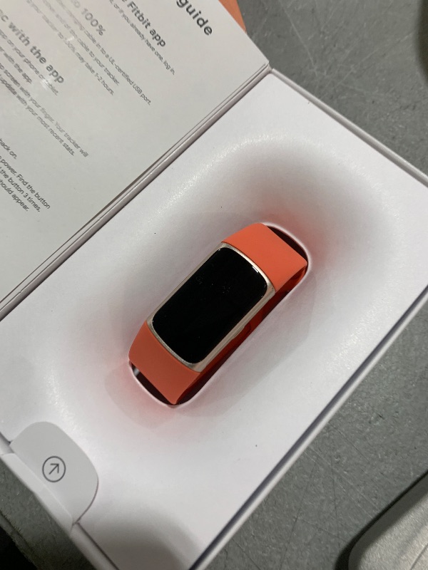 Photo 1 of Fitbit Charge 6 Fitness Tracker with Google apps, Heart Rate on Exercise Equipment, 6-Months Premium Membership Included, GPS, Health Tools and More, Gold/Coral, One Size (S & L Bands Included)