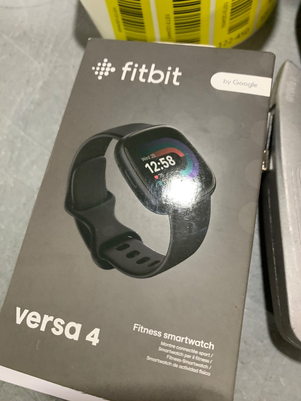 Photo 1 of Fitbit Versa 4 Fitness Smartwatch with Daily Readiness, GPS, 24/7 Heart Rate, 40+ Exercise Modes, Sleep Tracking and more, Black/Graphite, One Size (S & L Bands Included)