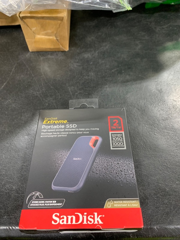 Photo 1 of SANDISK 2TB Extreme Portable SSD (Old Model) - Up to 1050MB/s, USB-C, USB 3.2 Gen 2, IP65 Water and Dust Resistance, Updated Firmware - External Solid State Drive - SDSSDE61-2T00-G25