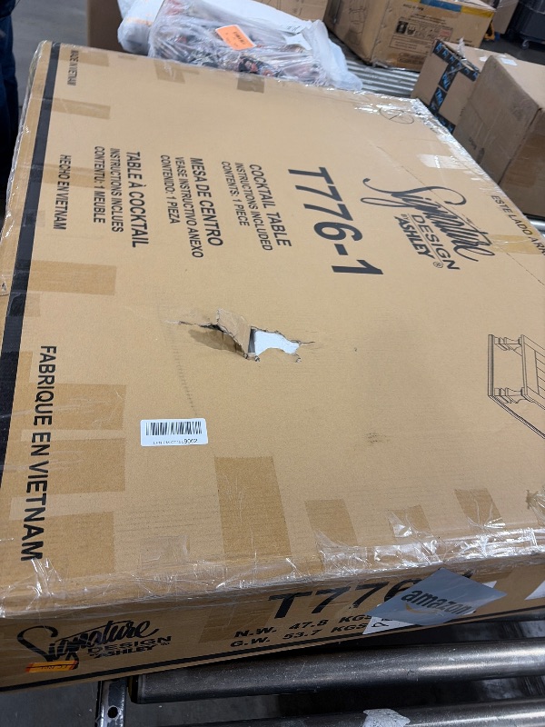 Photo 1 of Signature Design by Ashley Johnelle Farmhouse Coffee Table with Weathered Gray Finish, Gray