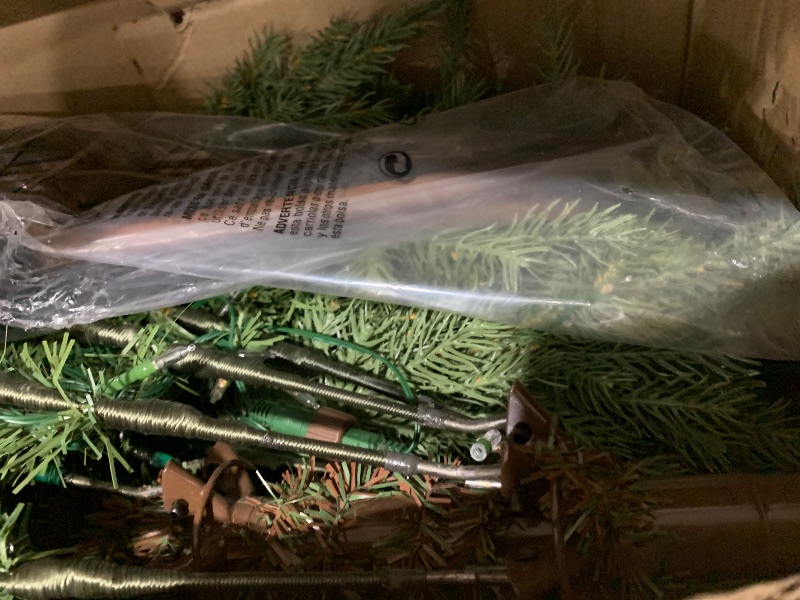 Photo 1 of National Tree Company 7.5 ft Pre-Lit Nordic Spruce Slim Artificial Christmas Tree, 600 LED Lights, 3,268 Tips, Foot Pedal, 10 Light Functions, Includes Stand, Green