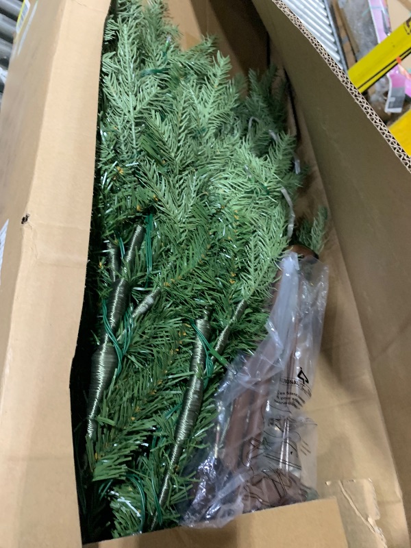 Photo 1 of National Tree Company 7.5 ft Pre-Lit Nordic Spruce Slim Artificial Christmas Tree, 600 LED Lights, 3,268 Tips, Foot Pedal, 10 Light Functions, Includes Stand, Green