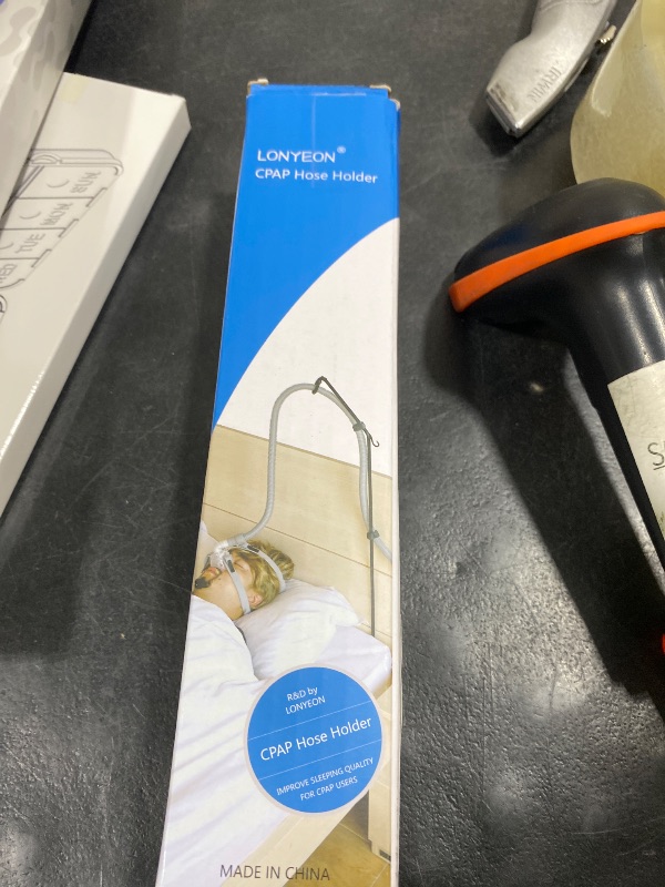 Photo 1 of LONYEON CPAP Hose Holder - CPAP Hose Hanger for Bed Avoid Tangling and Prevent Blockage,Keeps The Air Hose Up and Away from Your Face and Arms to Make You Sleep Better,Black
