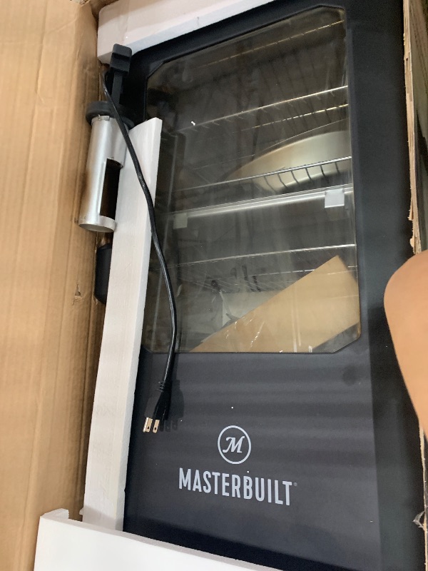 View 2 of (major usage, fucntions) Masterbuilt® 30-inch Digital Electric Vertical BBQ Smoker with Leg Kit, Side Wood Chip Loader and 710 Cooking Square Inches in Black, Model MB20070421
