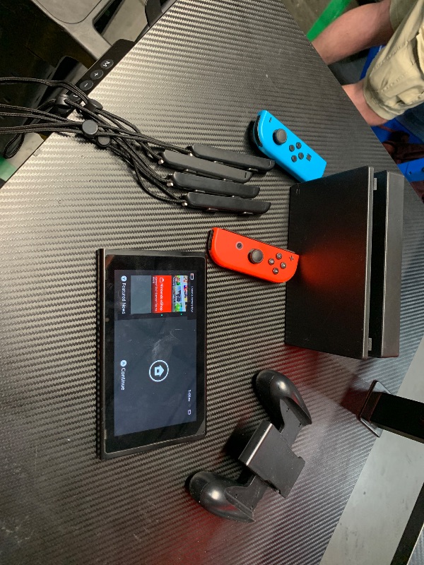 Photo 1 of ****System works*** Red joycon doesn’t connect****
Nintendo Switch with Neon Blue and Red Joy-Con (Renewed)