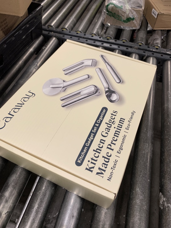 Photo 1 of Caraway Kitchen Gadget Set - 5 Piece Kitchen Essentials - Stainless Steel - Includes Can Opener, Pizza Cutter, Garlic Press, Ice Cream Scoop, Vegetable Peeler, and Storage Organizer