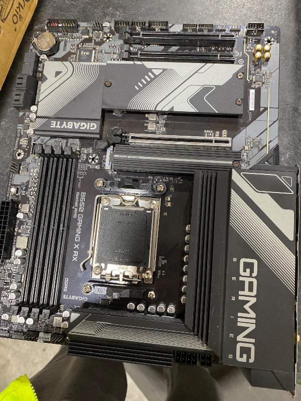 Photo 1 of GIGABYTE B650 Gaming X AX AMD AM5 ATX Motherboard, Support Ryzen 9000/8000/7000, DDR5, 8+2+1 Power Phase, 3X M.2, PCIe 4.0, USB-C 3.2 Gen 2, WIFI6E, 2.5GbE, EZ-Latch, Q-Flash, RGB Fusion