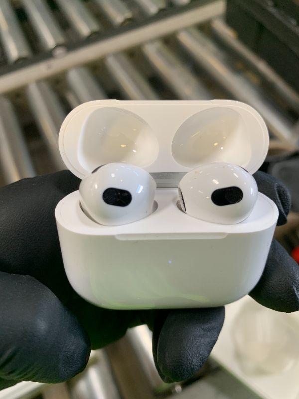 Photo 1 of Apple AirPods (3rd Generation) Wireless Ear Buds, Bluetooth Headphones, Personalized Spatial Audio, Sweat and Water Resistant, Lightning Charging Case Included, Up to 30 Hours of Battery Life