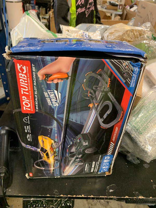 Photo 1 of Slot Car Race Track with 4 High-Speed Racing Cars Battery or Electric Race Car Toy for Kids Boys, Dual Racing Game 2 Hand Controllers Toys for Girls Children Age 6,7,8-12 Years Old