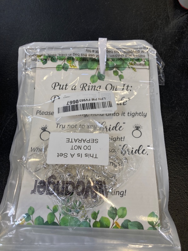 Photo 1 of Woanger Put a Ring on It Bridal Shower Game with 50 Fake Rings, Rustic Greenery Theme Wedding Shower Games Wedding and Engagement Rings and Not Say Bride Rules Cards(Leaves,Silver)