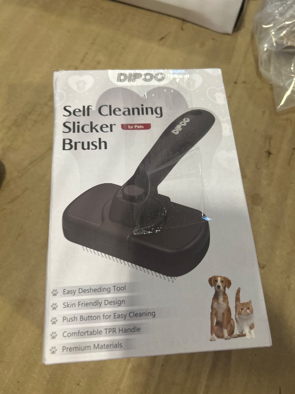 Photo 1 of Dipoo Self Cleaning Shedding Brush - Skin Friendly Grooming Tool for Dogs, Cats, and Puppies, Deshedding and Hair Removal for Long and Short Haired Pets, Black