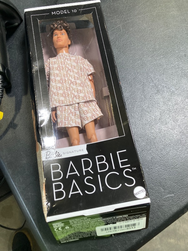 Photo 1 of Barbie Basics Model Collector Ken Fashion Doll 10 with Brunette Hair in Shirt & Shorts with Matching Print, Universal-fit Fashions & Posable Body