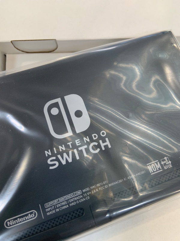 Photo 1 of Nintendo Switch with Neon Blue and Neon Red Joy?Con