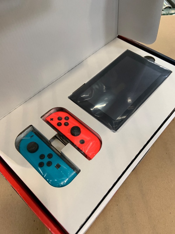 Photo 1 of Nintendo Switch with Neon Blue and Neon Red Joy?Con