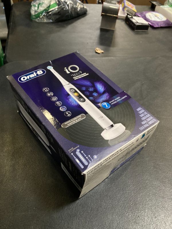 Photo 1 of Oral-B Rechargeable Electric Toothbrush, iO9 Genius, 7 Cleaning Modes, Interactive Display, Charging Travel Case, Visible Pressure Sensor, 4 Brush Heads, White Alabaster