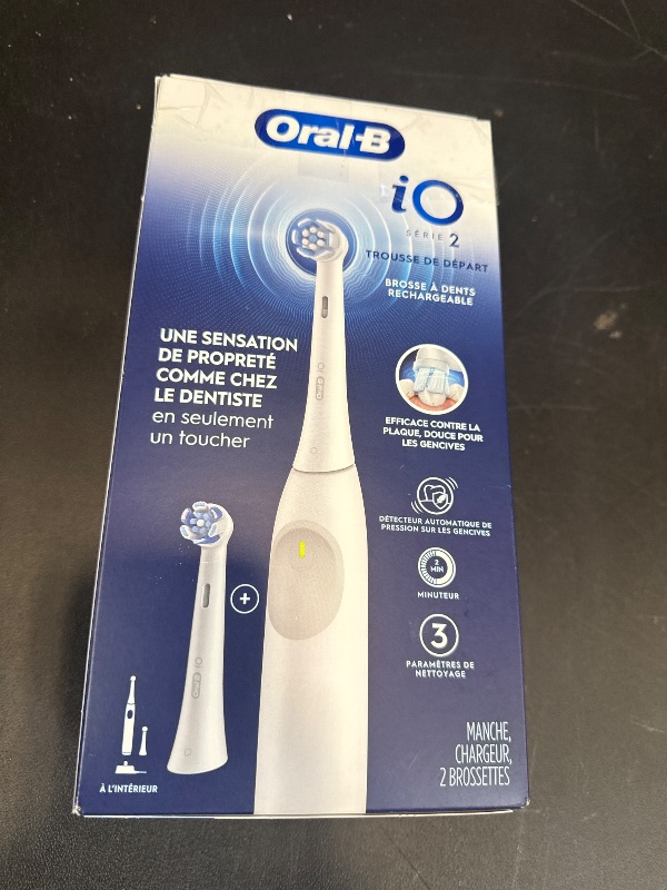Photo 1 of Oral-B Rechargeable Electric Toothbrush, iO2 Starter Kit, 3 Cleaning Modes, Automatic Pressure Sensor to Protect Gums, 2 Brush Heads, Pure White