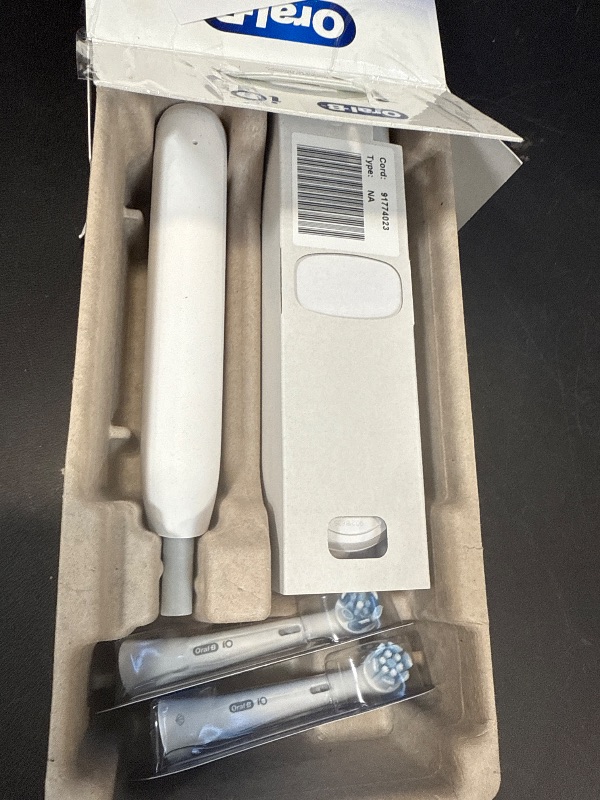 Photo 1 of Oral-B Rechargeable Electric Toothbrush, iO2 Starter Kit, 3 Cleaning Modes, Automatic Pressure Sensor to Protect Gums, 2 Brush Heads, Pure White