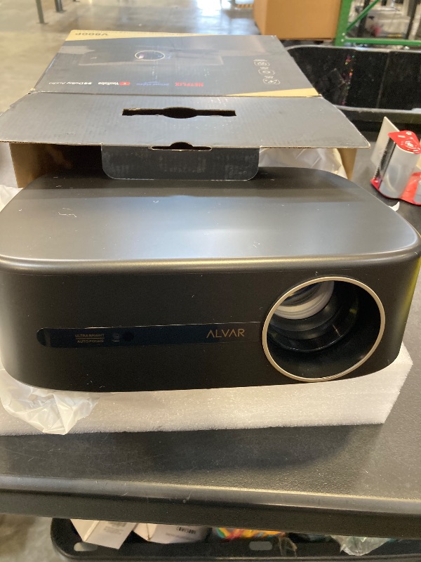 Photo 1 of Alvar Smart Projector 2026 Upgraded, 2500 ANSI, 4K Supported, Built in NetfIix App, DoIby Audio & 50W Speakers, Auto Focus, WiFi 6, Bluetooth 5.3, Home Theater & Outdoor Movie Projector, Black