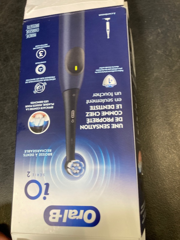 Photo 1 of Oral-B Rechargeable Electric Toothbrush, iO2, 3 Cleaning Modes, Automatic Pressure Sensor to Protect Gums, Dark Blue