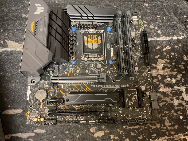 View 2 of ASUS TUF Gaming B850M-PLUS WiFi AMD AM5 B850 mATX Motherboard, 14+2+1 80A DrMOS Stages, DDR5, PCIe 5.0, 3X M.2, Wi-Fi 6E, 2.5Gb LAN, DP, HDMI™, USB 10Gbps & 20Gbps Type-C®, BIOS Flashback™, Aura Sync