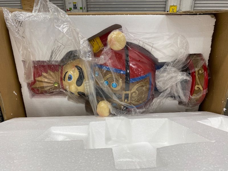 Photo 1 of **broken arm** Fraser Hill Farm 3-Ft. Nutcracker Toy Soldier on a Pedestal Base, Resin Statue w/ LED Lights, Indoor or Covered Outdoor Christmas Decor, Red