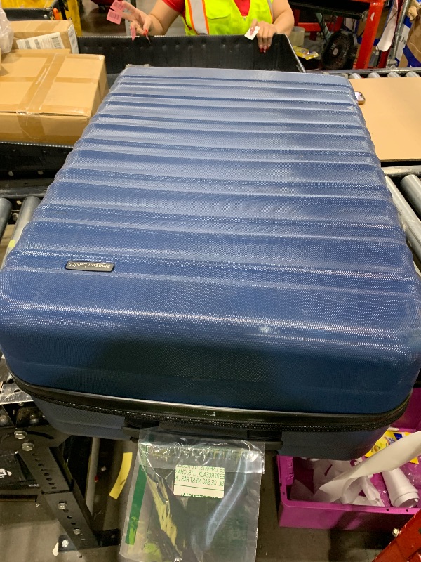 Photo 1 of Amazon Basics 30" Hardside Large Checked Luggage with Multi-directional Wheels, Expandable for Up to 15% More Space, Scratch-Resistant Hardshell, Navy Blue